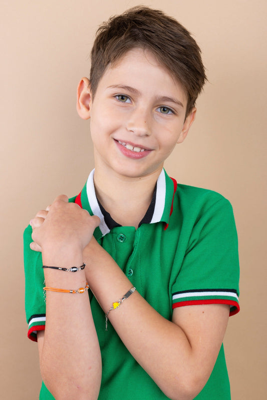 Boy wearing massete bracelets getting ready for school