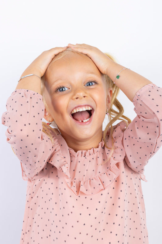 Girl wearing Massete kids safe sterling silver jewelry